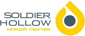 Soldier Hollow Nordic Center logo, with a navy circle in a yellow teardrop shape.