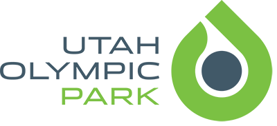 Utah Olympic Park logo, with a navy circle in a neon green teardrop shape.