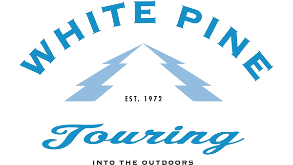 White Pine Touring logo, with a pine tree and text “Est. 1972 Into the Outdoors”.